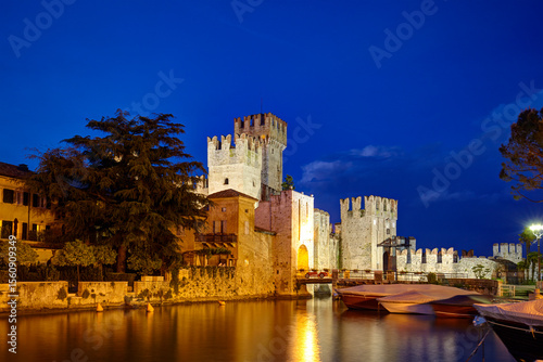 The scaliger castle of Sirmione, on the Garda lake, at blue hour, Sirmione, Italy photo