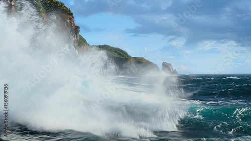 Powerful Ocean Waves Crashing Against Rugged Coastal Cliffs