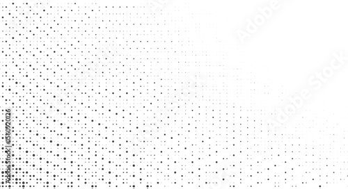 Abstract pattern of varying sized black dots on a white background