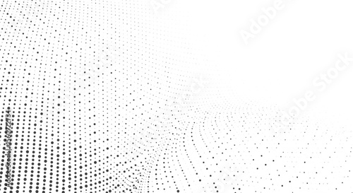 Abstract background of black dots of varying sizes on a white background