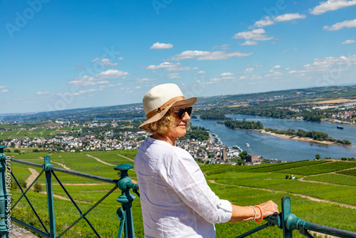 Bild auf Leinwand woman enjoys the beautiful view from the platform at Niederwald monument to the