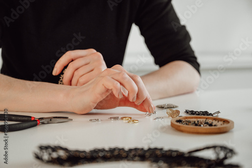 Handmade creative hobbies concept. Jewelry master setting table for tatting accesories