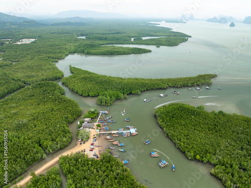 Ban Hinrom pier Longtail fishing boats in the sea located at Phang Nga province Thailand photo