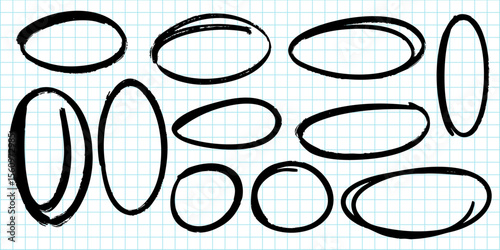 collection of hand drawn oval and circle shapes in black marker on a blue grid paper background.