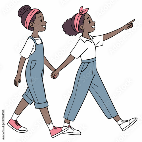 Sisters walking together pointing forward in matching outfits denim overalls