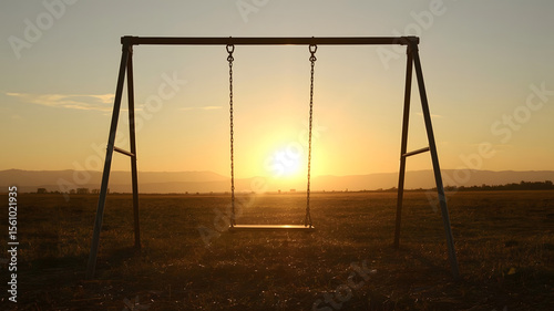 Empty swings invite childhood memories of summer fun in parks or by the beach