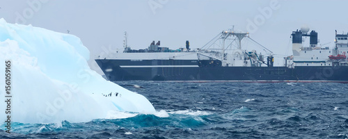 Large ship and ice floe in the open sea.