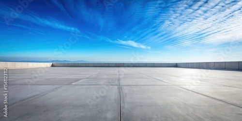 Expansive Concrete Plaza with a Panoramic View of a Serene Horizon Under a Vivid Blue Sky