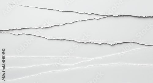 White torn paper edges with rough textures creating layered abstract design