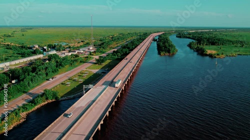 Wallpaper Mural Long bridge cutting through Louisiana wetlands — cinematic, moody, and perfect for storytelling or visual metaphors. Torontodigital.ca