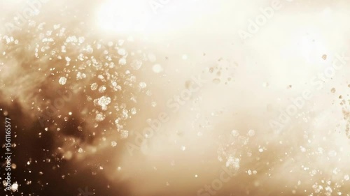 Abstract light brown background with scattered particles