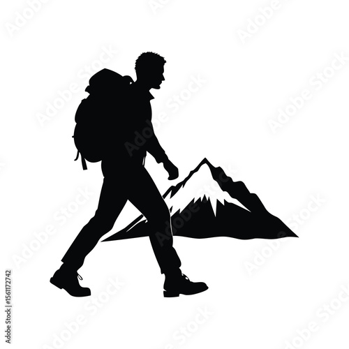 Silhouette of a Hiker with Backpack Climbing a Mountain Trail