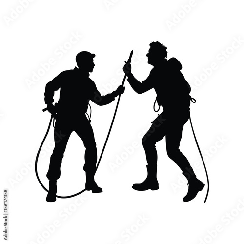Silhouette of two firefighters or rescue workers with ropes, in action