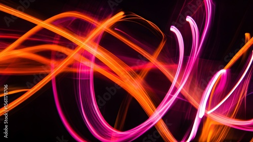 Vibrant pink and orange neon ribbons dance gracefully on a soft black background, creating dynamic energy.