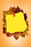 Autumn leaves with yellow note