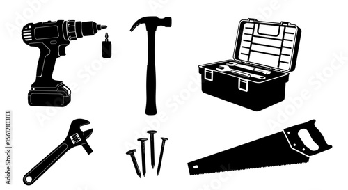 Assortment of construction tools including a drill hammer toolbox wrench nails and saw is displayed