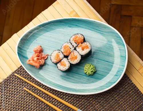 Fresh hosomaki rolls, filled with salmon
