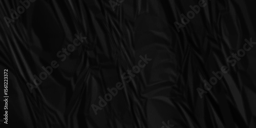 Wrinkled paper creased black crumpled texture. Black crumpled and top view textures can be used for background of text or any contents.	
