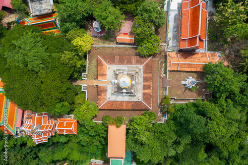Ancient Wat Pha Kho temple in Songkhla, Thailand, showcasing Buddhist architecture and historical reverence. Serene cultural landmark.