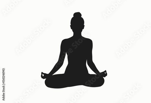 Silhouette of a woman practicing yoga meditation in lotus pose  