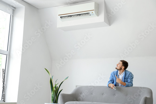 Young man with air conditio...