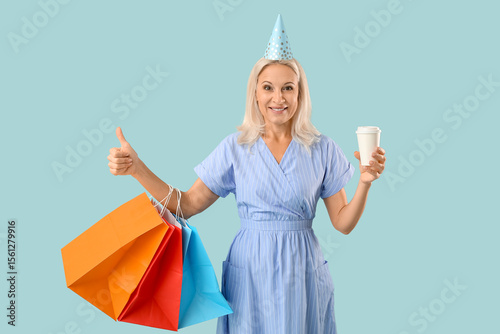 Mature woman in party hat w...