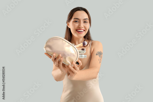 Beautiful young woman with ...