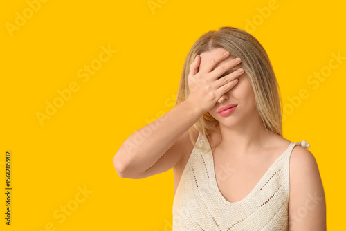 Young woman doing facepalm ...