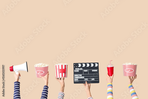 Many hands with movie clapp...