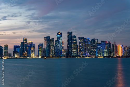 Wallpaper Mural Panoramic view of the tall skyscrapers of Doha in Qatar At sunset. Persian Gulf countries. Doha skyline view with sea Torontodigital.ca