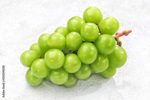 Anggur Muscat. Muscat grapes, especially the Shine Muscat variety, are a type of grape known for their distinctive sweet taste and unique muscat aroma.