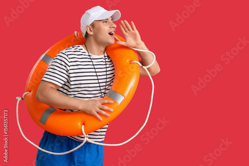 Handsome male lifeguard wit...