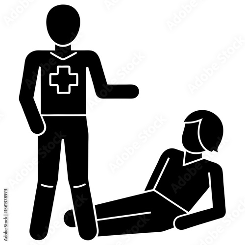 First aid provider assisting an injured person lying on the ground