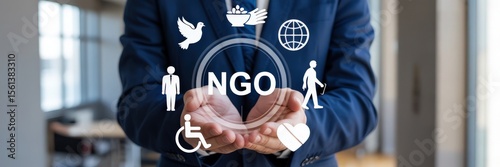 Hands holding a digital display of an ngo with various support icons.