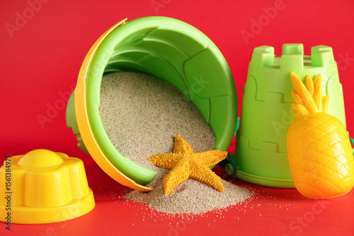 Colorful beach toys with sa...
