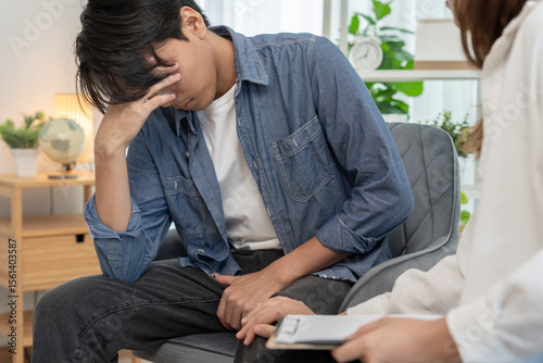 Papier peint Man hold hand in front of private parts feeling discomfort and consult doctor