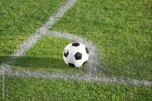 Soccer ball on green stadium grass
