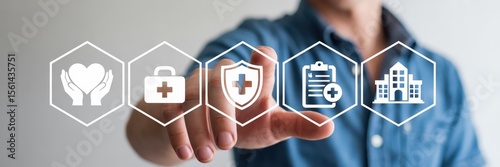 Wallpaper Mural A hand interacts with a digital interface showcasing healthcare icons. Torontodigital.ca