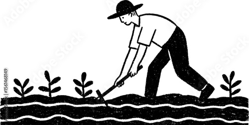 Farmer raking leaves in garden with young plants