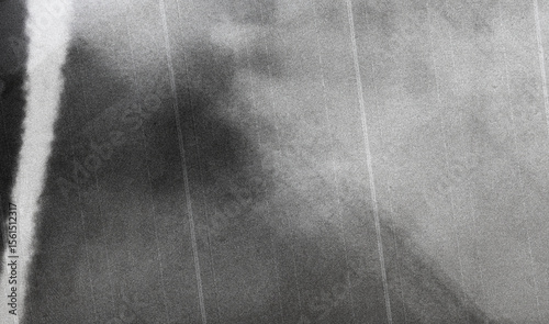 Old film texture with scratches, noise and glitch shapes. Realistic overlay film texture in black-white, dust and grain. Distressed retro movie or photo negative effect of cinema nostalgia. Artwork