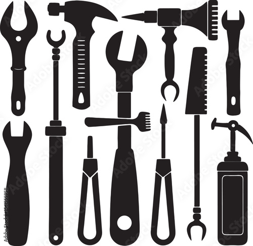Collection of silhouetted hand tools including a hammer and wrenches	