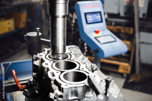 Service Boring under the piston after engine sleeve using machine with Computer Numerical Control. Engine cylinder boring on cnc machine.