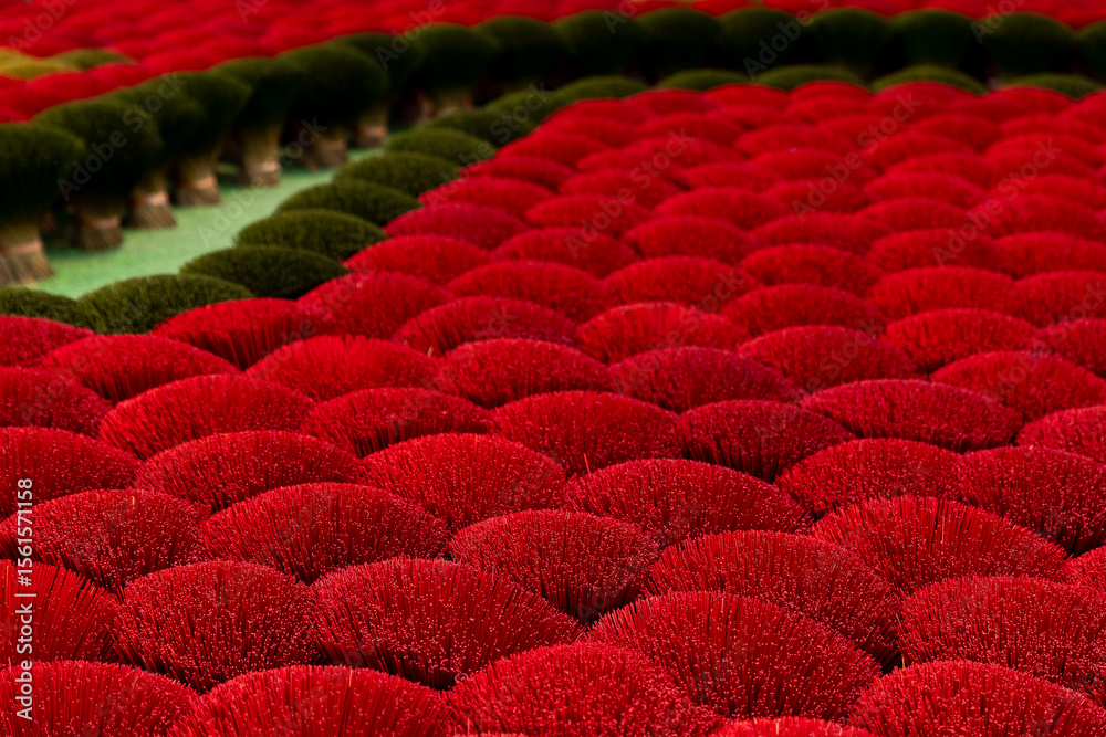 Obraz premium Traditional vietnamese incense sticks production in craft village