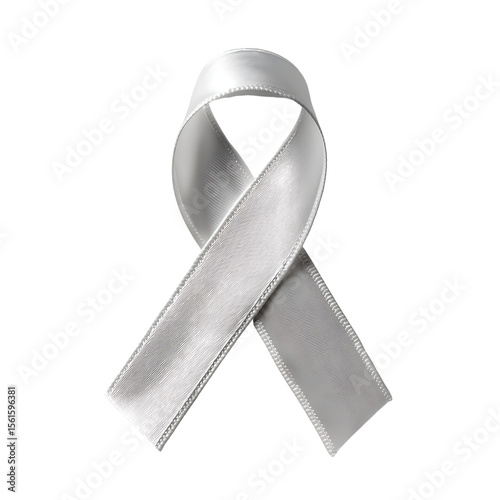 A white ribbon made of fabric is placed against a black backdrop It is symmetrical and has a silky texture