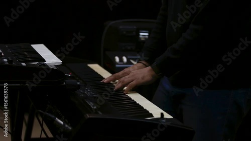 Close-Up of Pianist’s Hands Playing a keyboard