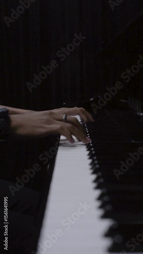 Close-Up of Pianist’s Hands Playing a Grand Piano