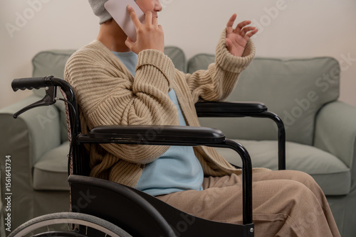 Lonely Asian women was sick and sitting on wheelchair. Lifestyle and stay at home alone.