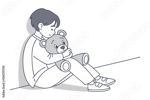 Boy's Tender Embrace: A young boy finds comfort and solace as he lovingly holds a teddy bear close, creating a heartwarming scene of childhood innocence.