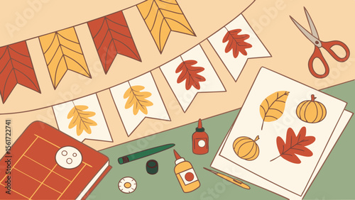 Autumn themed crafting scene with leaf garland, scissors, and autumn leaf and pumpkin cutouts on paper
