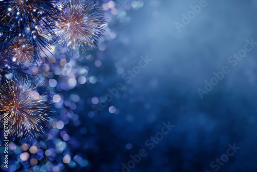Festive New Year’s Eve celebration with vibrant fireworks and a shimmering blue backdrop